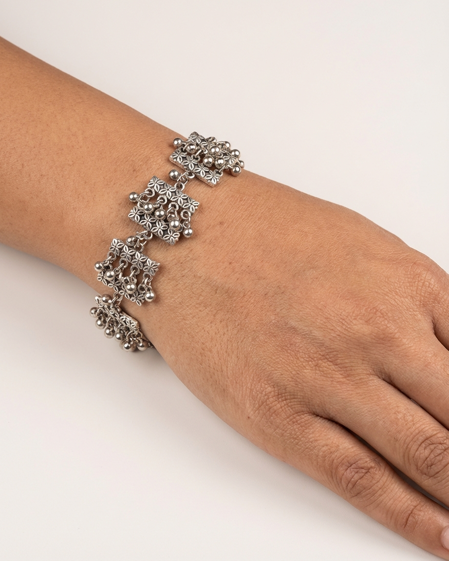 Oxidized Silver-Plated Ethnic Floral Link Bracelet with Ghungroo Charms